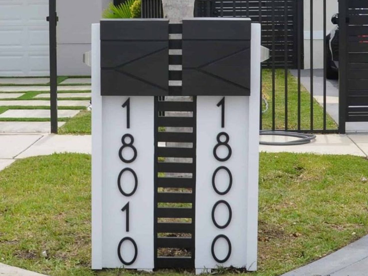 Set of bronze and white mailboxes